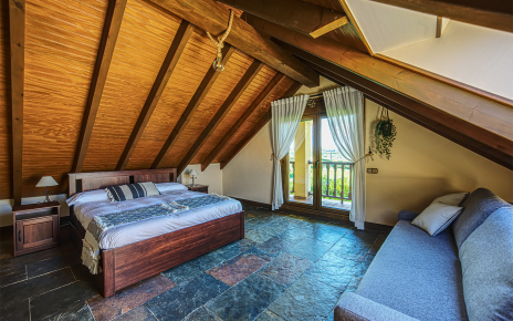First-floor bedroom with sloping ceilings